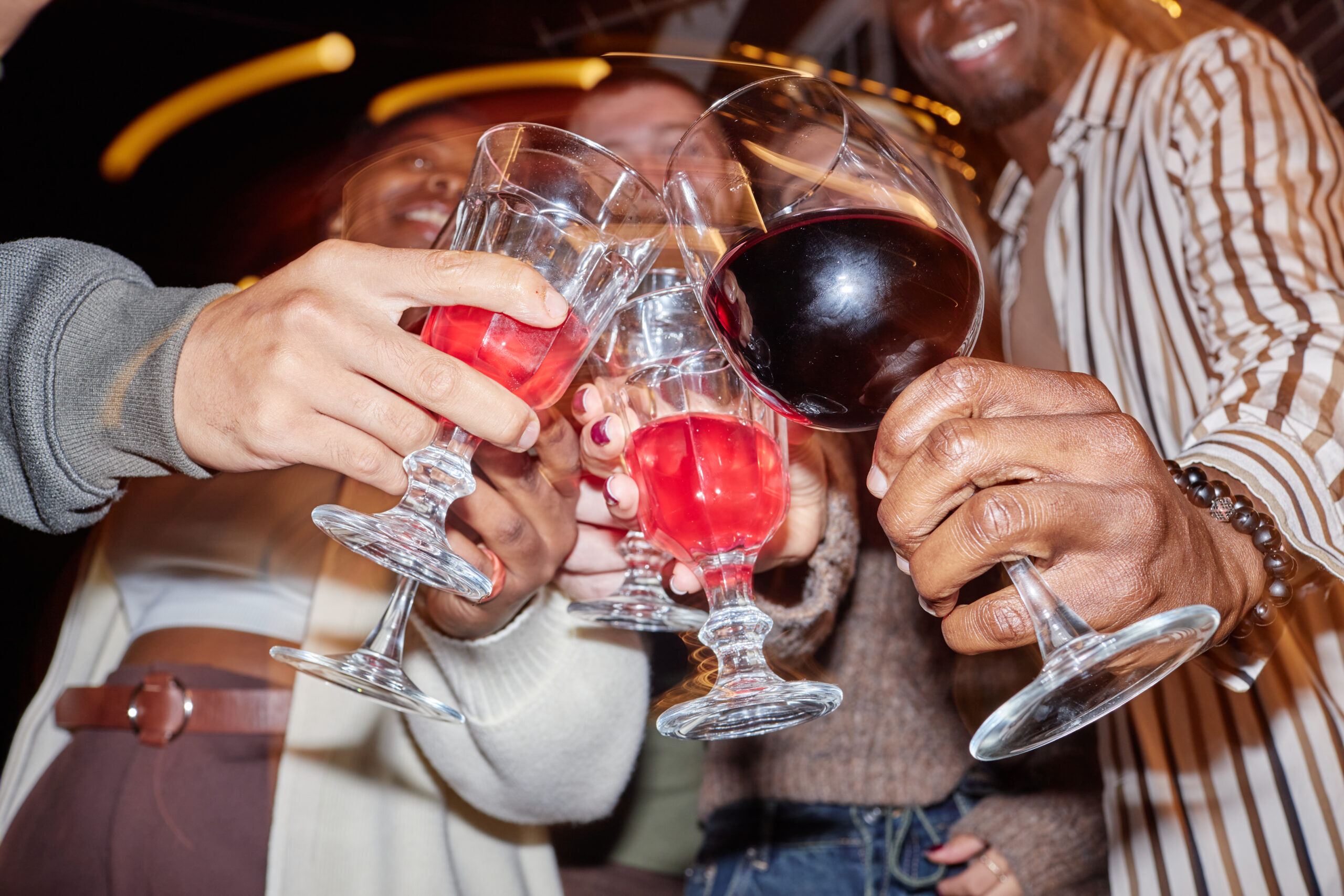 adults toasting with alcohol